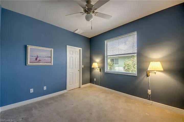 Bedroom #3 with carpet, large window and large walk-in closet