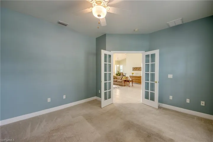 This Bedroom #4/Den/Office has a well appointed Closet and double door entry.   Carpet in all bedrooms