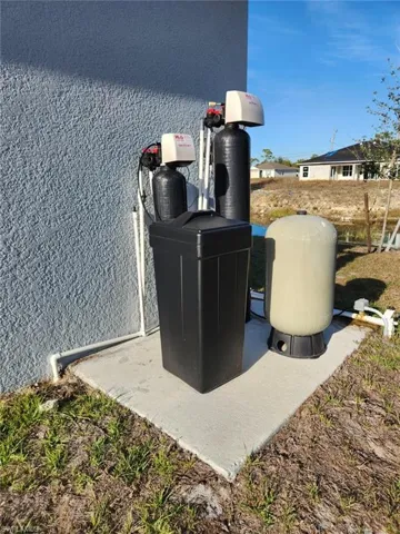 Exterior view of a water softener system and pump