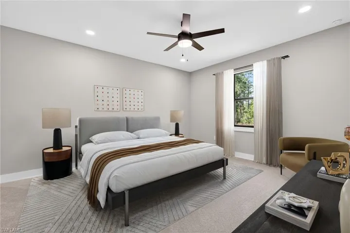 Bedroom featuring light carpet, ceiling fan, and recessed lighting
