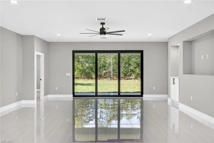 Spare room featuring recessed lighting, ceiling fan, and light tile patterned floors