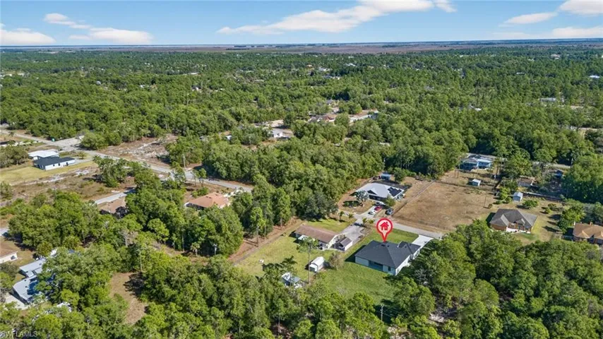 View of property location featuring a heavily wooded area
