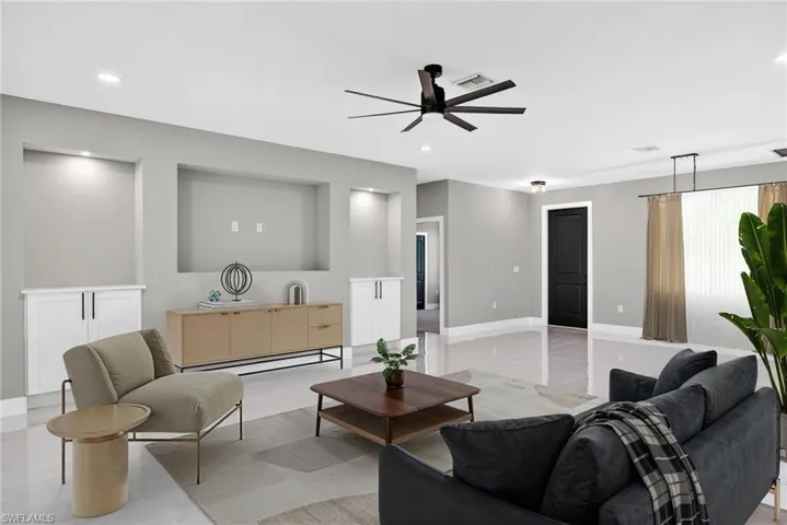 Living area with ceiling fan and recessed lighting