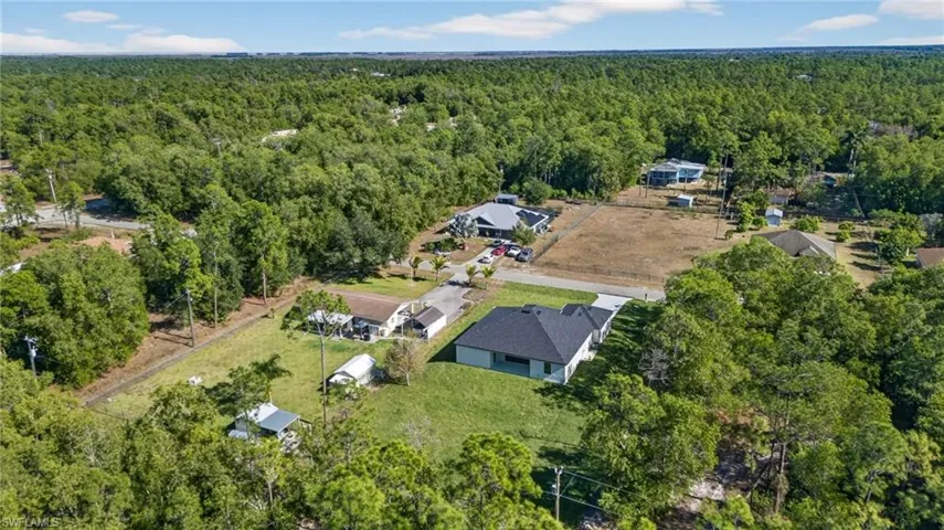 View of property location featuring a heavily wooded area