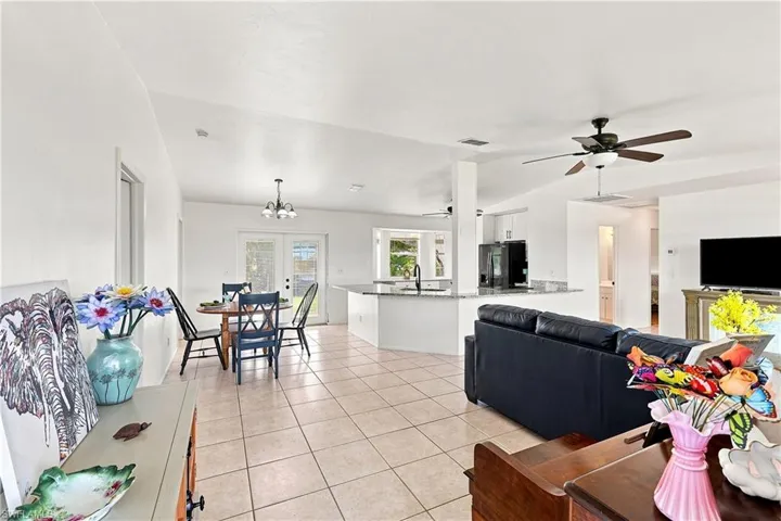 Expansive interior featuring tiled flooring and vaulted ceilings