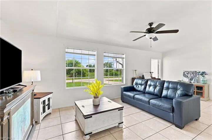 Living area featuring neutral-toned tile flooring throughout