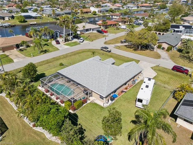 Aerial perspective of suburban area with a nearby body of water