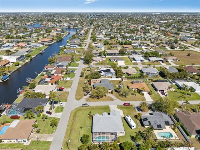 View of property location featuring nearby suburban area and a nearby body of water