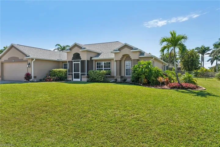 Ranch-style home with stucco siding and an attached garage