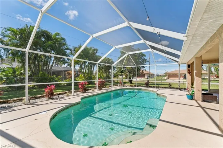 Outdoor pool with a patio area and a lanai