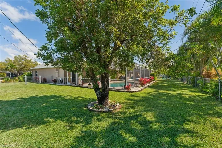 View of yard featuring a lanai