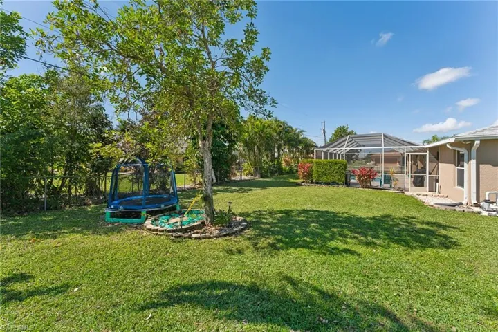 View of yard with a trampoline
