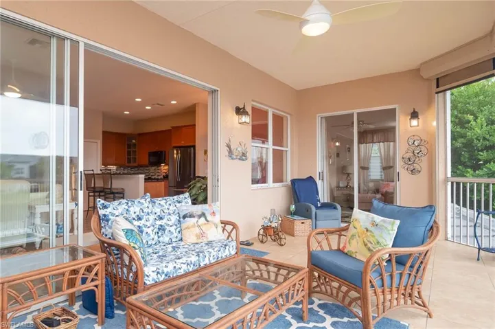 Sunroom featuring ceiling fan