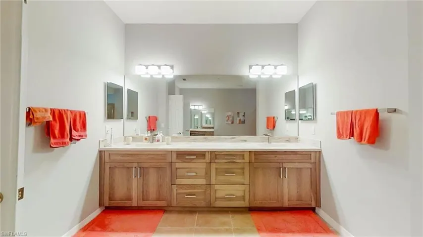 Bathroom featuring tile patterned flooring and vanity