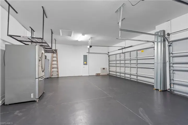over head storage, extra refrigerator, 3 car garage