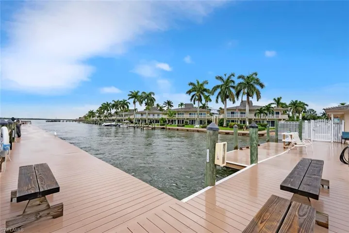 Dock area featuring a water view
