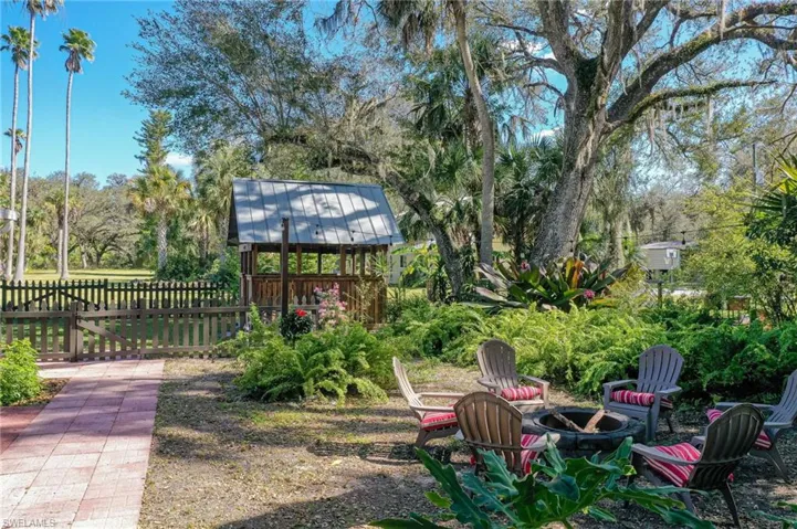 View of Fire pit, and BBQ area, and landscaping. Can also be seen from In-Law Screened porch.