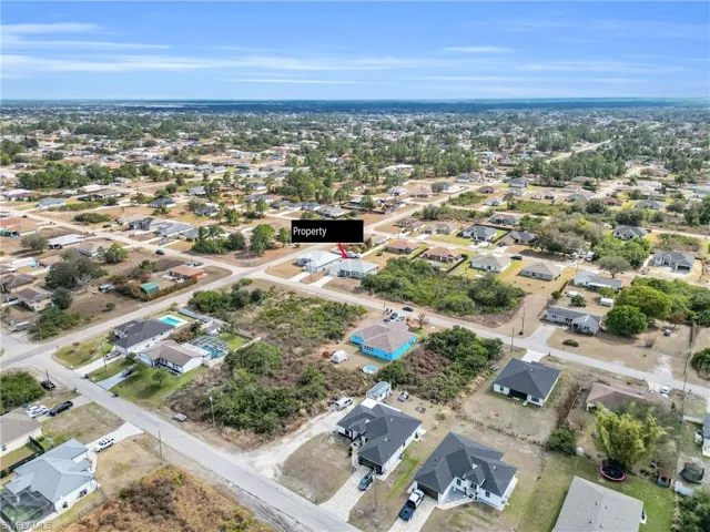 View of property location with nearby suburban area