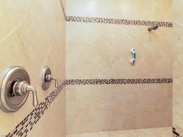 Full bathroom with tiled shower