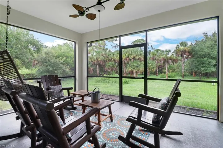 Sunroom / solarium featuring ceiling fan