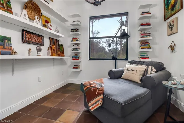 Living area with dark tile patterned floors