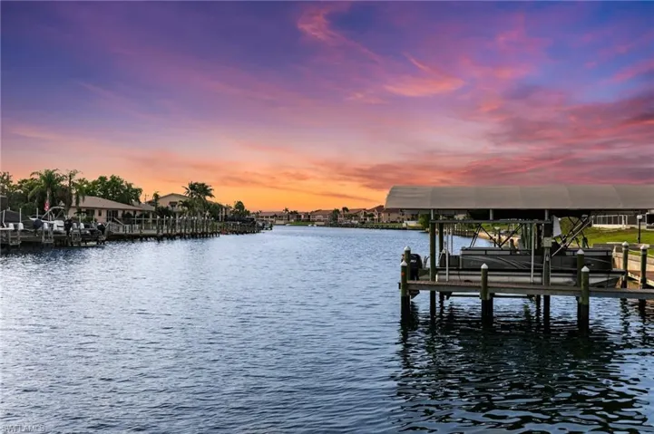 Dock area featuring a water view and boat lift