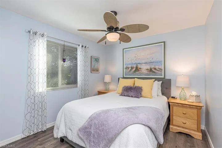 Bedroom featuring ceiling fan and dark wood-style floors