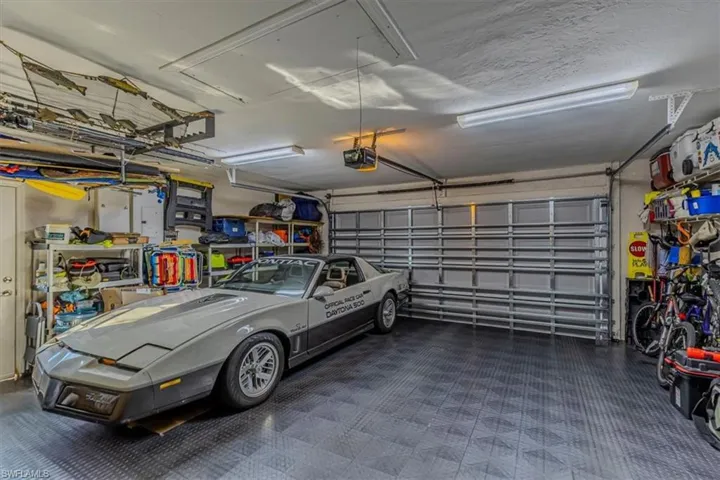 Garage featuring a garage door opener