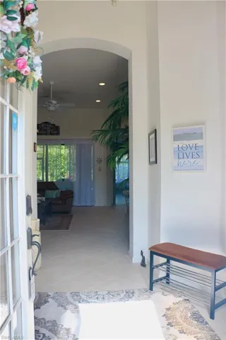 Entrance to property with ceiling fan