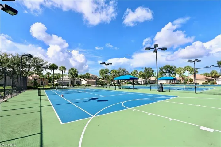 View of sport court featuring fence and community basketball court