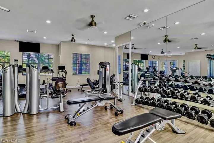 Workout area with visible vents, a ceiling fan, wood finished floors, and recessed lighting