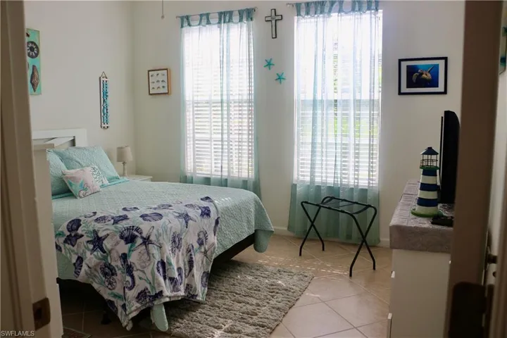 Tiled bedroom with baseboards