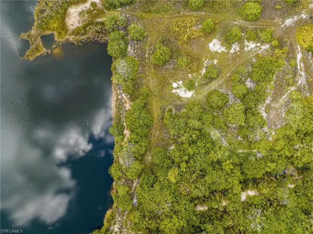 Aerial overview of property's location featuring a large body of water