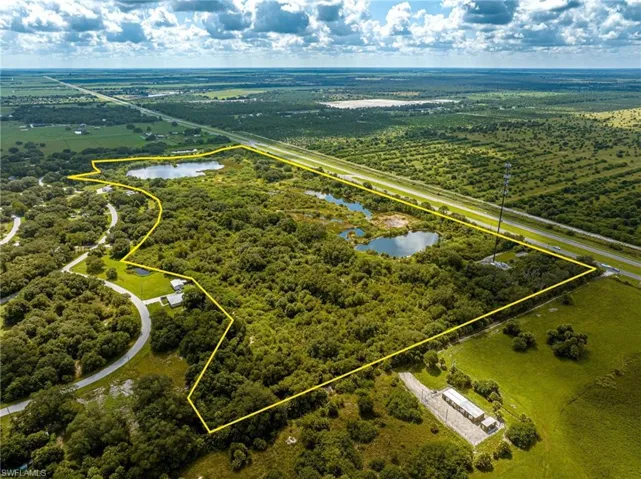 View of property location featuring property boundaries highlighted and a large body of water