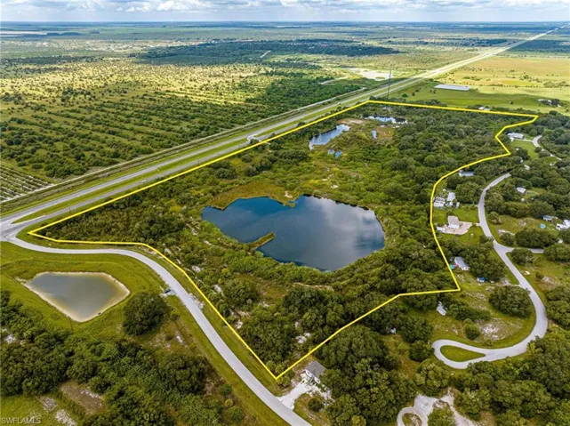 View of property location featuring a large body of water and property parcel outlined