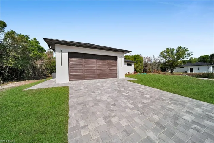 Garage featuring driveway