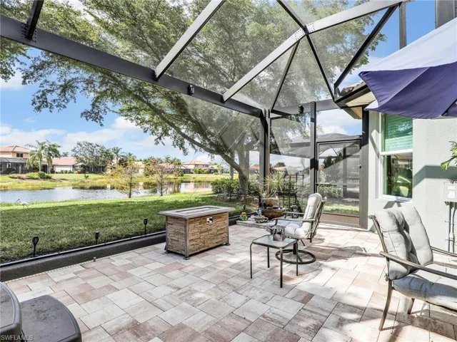 Unfurnished sunroom featuring a water view