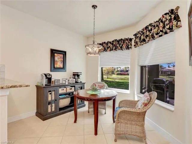 Dining room featuring a chandelier and light tile patterned flooring