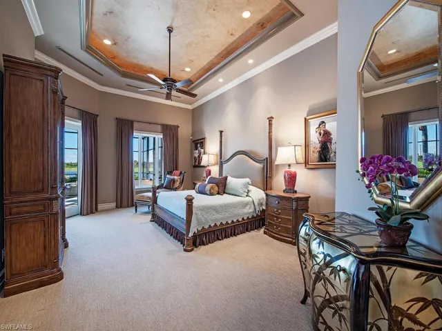 Expansive primary bedroom with access and views of the lanai