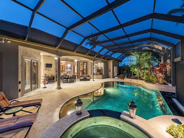 Lanai, pool and hot tub at twilight...........