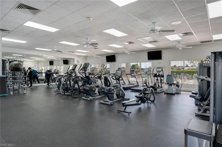 Workout area featuring a drop ceiling