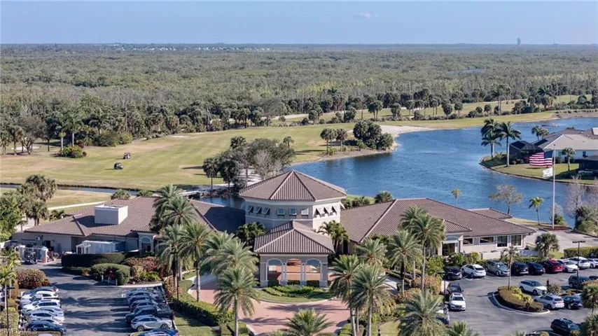 Drone / aerial view of a large body of water and a golf course