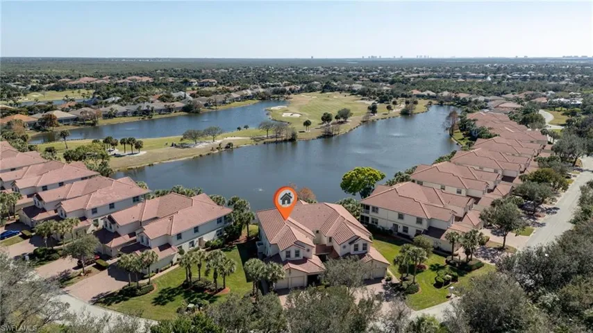 Aerial overview of property's location with nearby suburban area and a large body of water