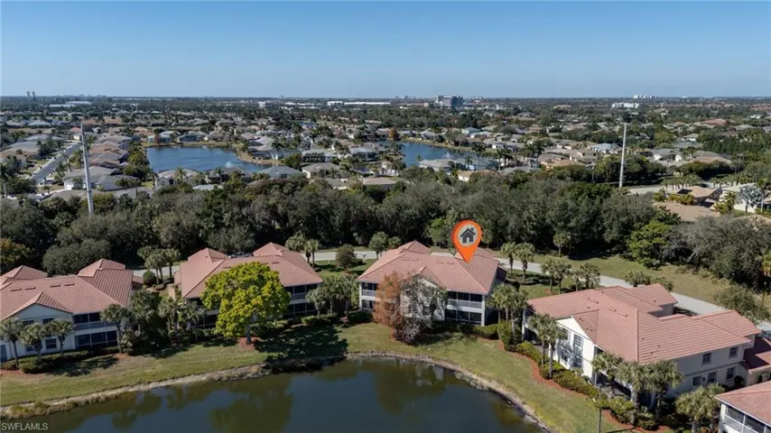 Aerial perspective of suburban area with a large body of water