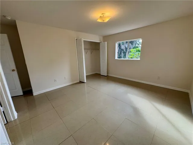 Primary bedroom overlooking backyard