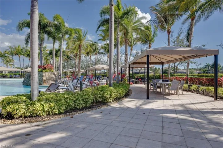 View of property's community featuring a gazebo, a patio area, and outdoor dining space