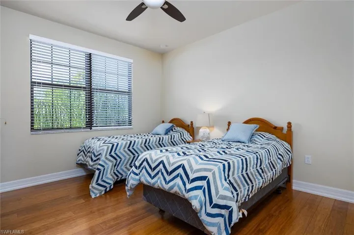 Bedroom featuring hardwood / wood-style floors and ceiling fan