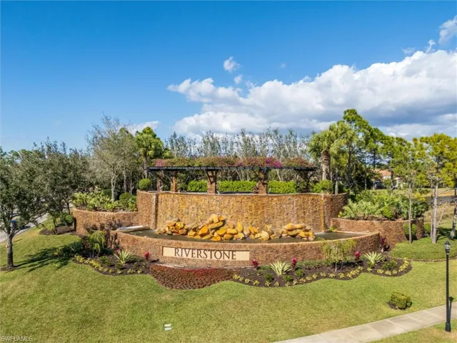 Community sign featuring a lawn