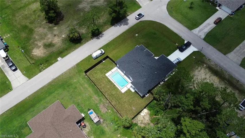 View of subject property featuring a pool