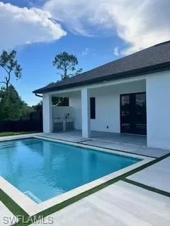 View of swimming pool with a patio